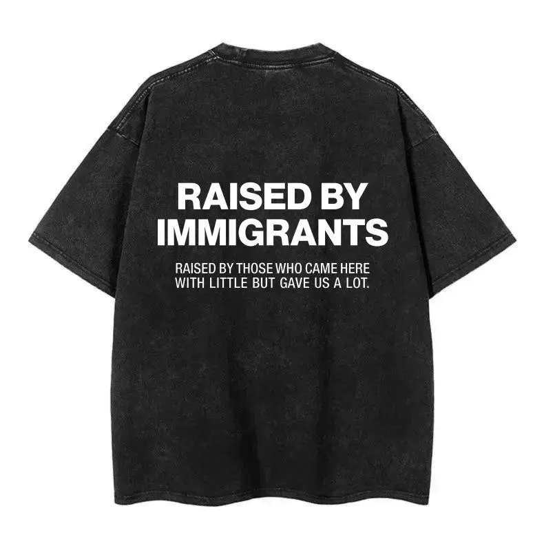 Women's Vintage Washed Black Cotton Oversized Round-Neck Short-Sleeve Tops - "Raised By Immigrants" Statement Graphic, Soft Everyday Streetwear Casual Tee for Women, Love-Inspired Design