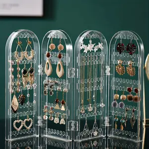 Clear Acrylic Earring Display Stand, large capacity oval jewelry organizer with sturdy plastic build. Freestanding design ideal for retail shops, boutiques and small businesses. Perfect for jewelry storage, display and elegant commodity showcasing