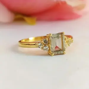 A light-luxury, vintage-inspired emerald-cut synthetic zirconia ring. This classic French-style band ring is a minimalist, high-end jewelry piece perfect for stacking. It also makes an excellent choice for an engagement ring or an anniversary gift.