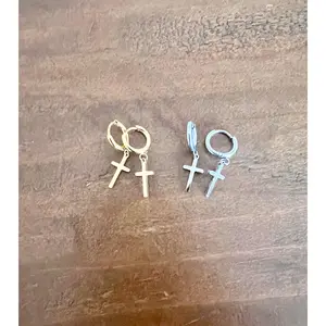cross huggie earrings