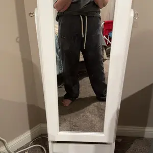 Customer wearing black corduroy pants