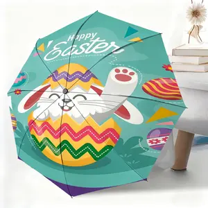 This waterproof folding umbrella features an Easter bunny and egg cartoon design, suitable for both men and women, and is portable for travel and everyday use.