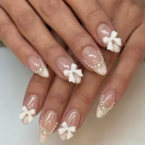 24Pcs Almond Press on Nails French Tips Short Nails with Cute Bow Charms Design French Press on Nails Nude Pink Acrylic Nails Almond Shaped Artificial Nails for Women Manicure Tip LRKNNO