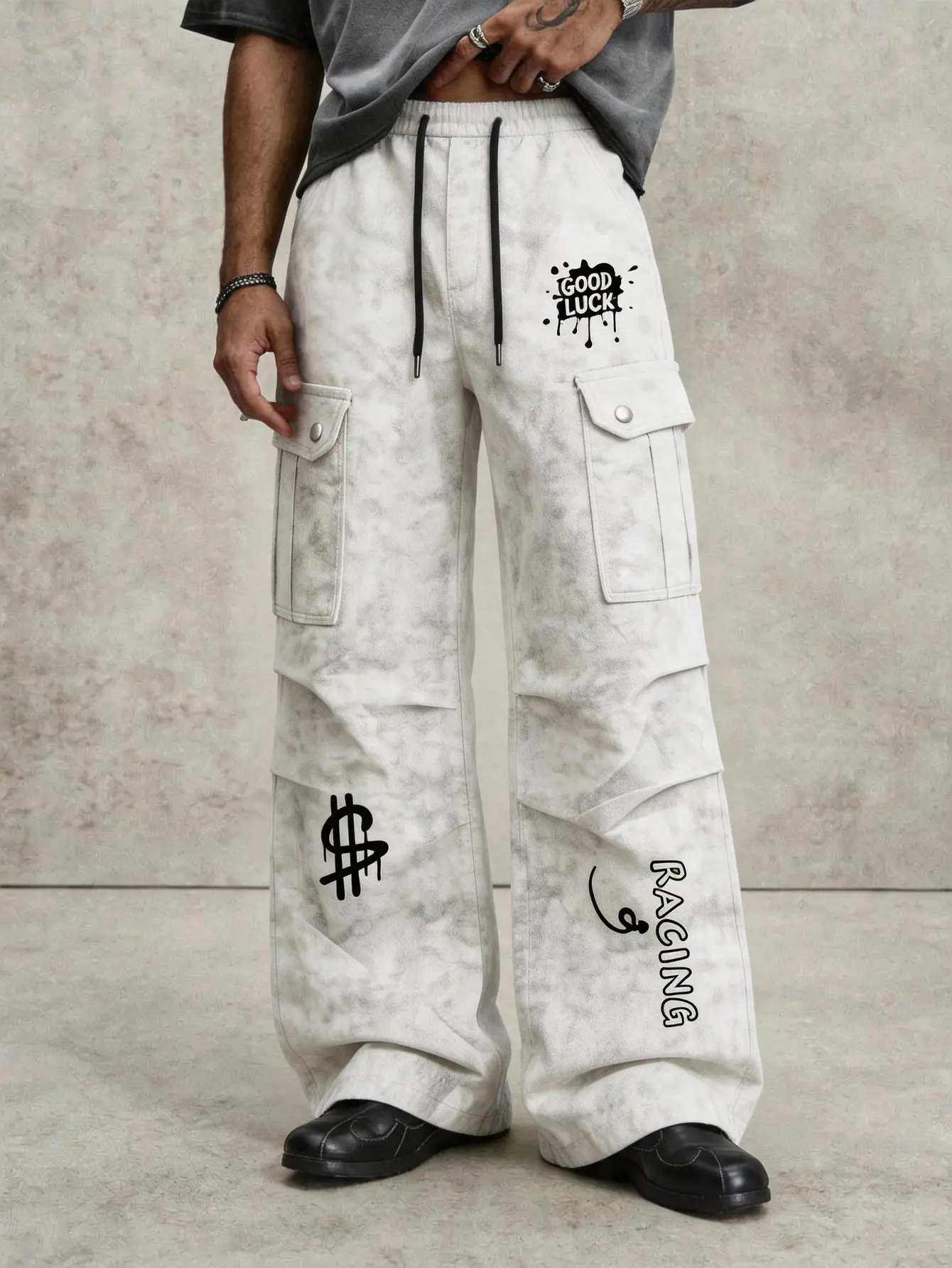 【Water-washed tie-dye distressed men’s cargo pants with multiple pockets and a slight flared wide-leg cut】 Adjustable drawstring waist for comfort; casual long pants featuring money symbol, letter spray graffiti print; 3D side pockets and ruched pant legs
