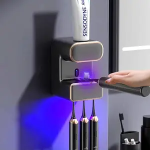 Toothpaste Dispenser, Toothpaste Dispenser Multi-Function, Toothpaste Dispenser Wall Mounted with 3 Brush Slots, Toothbrush Organizer and Holder for (Black)