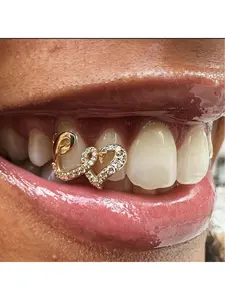 Double heart copper hip-hop dental braces, teeth decoration, unique trend tooth jewelry, personalized infinity symbol decoration, gold teeth.