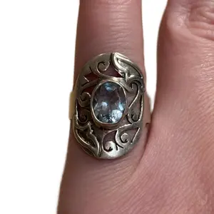 Handmade Sterling Silver Saddle Filigree Ring with Oval Blue Topaz
