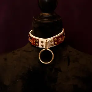 White and gold "owned slave" collar