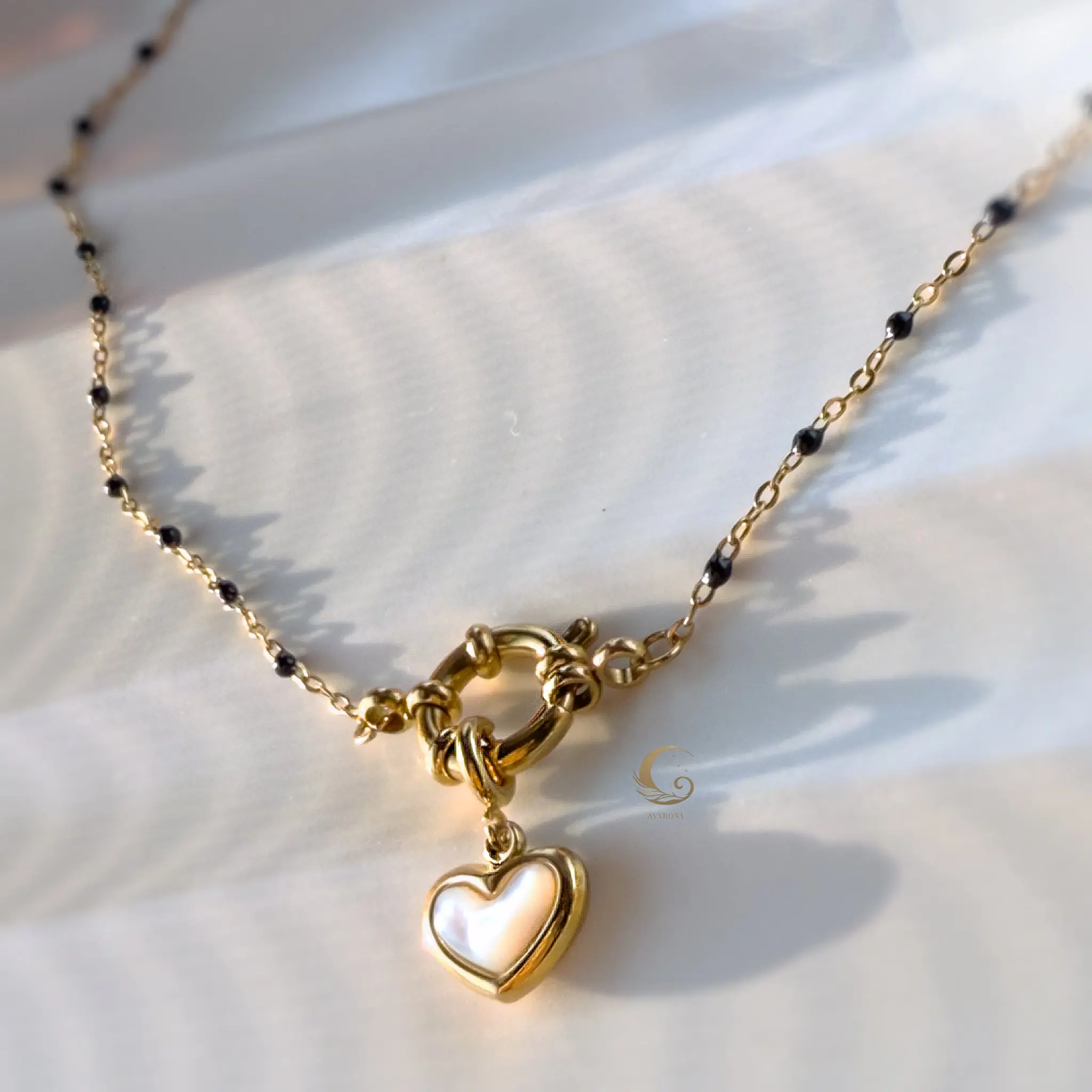 Mira – Navy Beaded Necklace with Heart Charm.