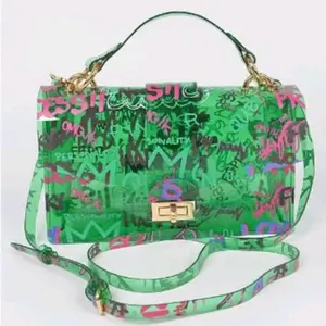 Graffiti Clutch Bag - Green Color with Graffiti Pattern, Adjustable Strap, and Gold-tone Hardware