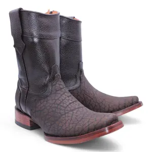 🔥 Step into bold with our Chocolate Bull Neck Leather Boots! Dubai square toe, handcrafted for comfort & Western edge. Built to turn heads 🤎