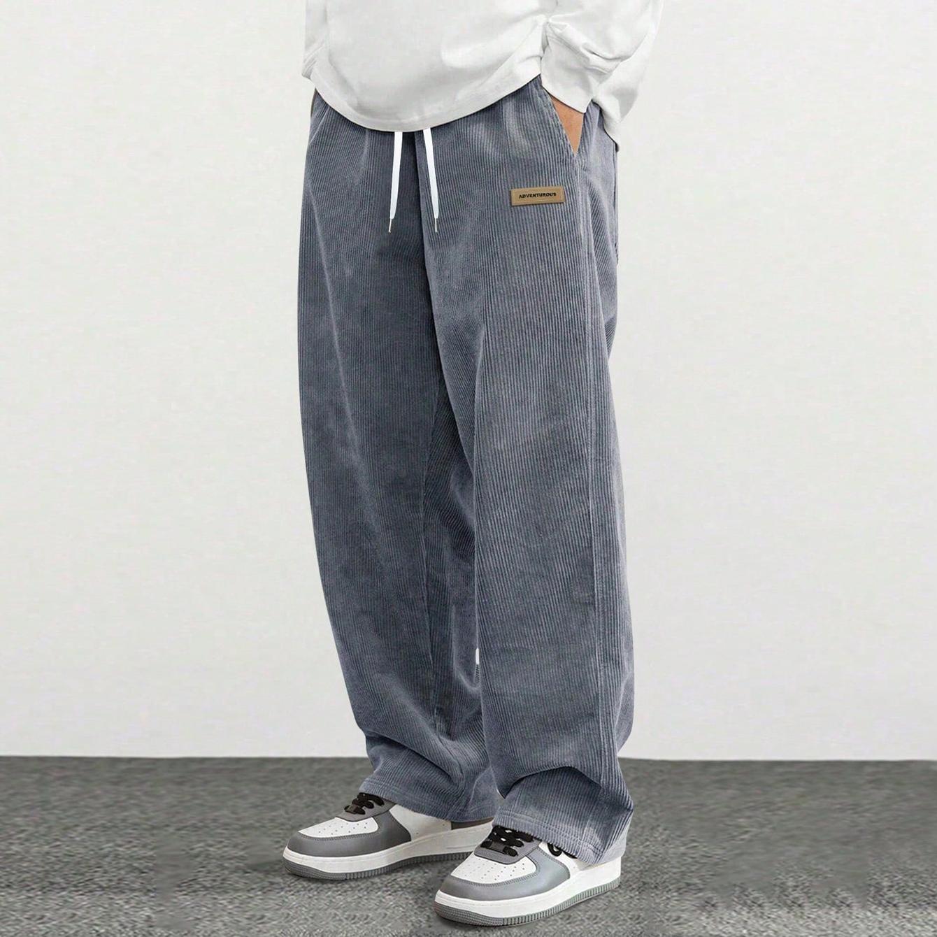 Men’s corduroy casual pants, loose straight fit, simple and versatile, suitable for spring and autumn wear.