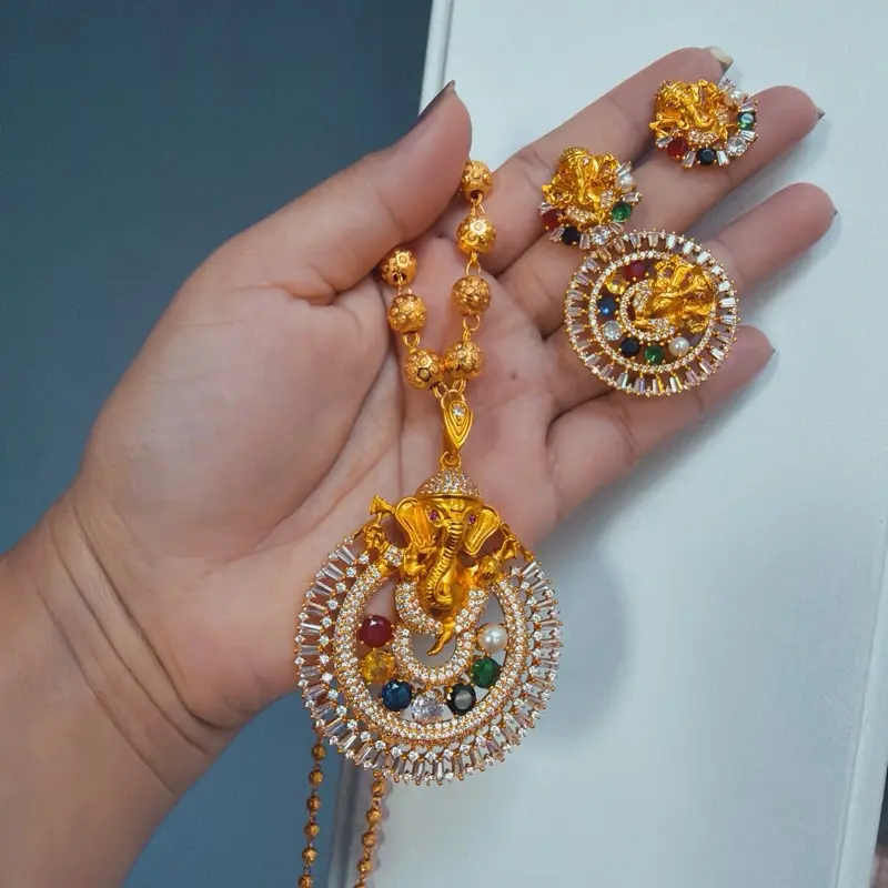 Gold Tone Ganesh Navratna Pendant Ball Necklace Set with Adjustable Finger Ring and Matching Earrings