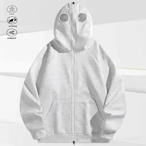 A men's zip up hoodie with a unique eye hole cutout design, featuring a fun and stylish "hood over head" appearance. The zipper closure allows for easy wear and removal, while the large front pocket adds practicality.