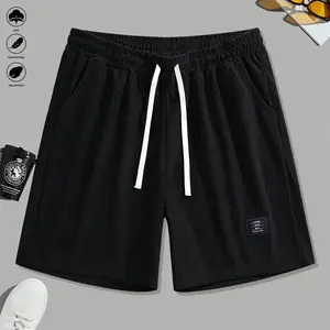 Men’s summer solid-color drawstring beach shorts made of corduroy, featuring a casual fit, side-entry pockets, and a loose athletic silhouette for outdoor wear; also suitable as summer casual running shorts.