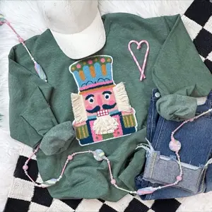 Yarn and Chenille Nutcracker Face Holiday Sweatshirt in Green with Festive Embroidery and Heart Accents