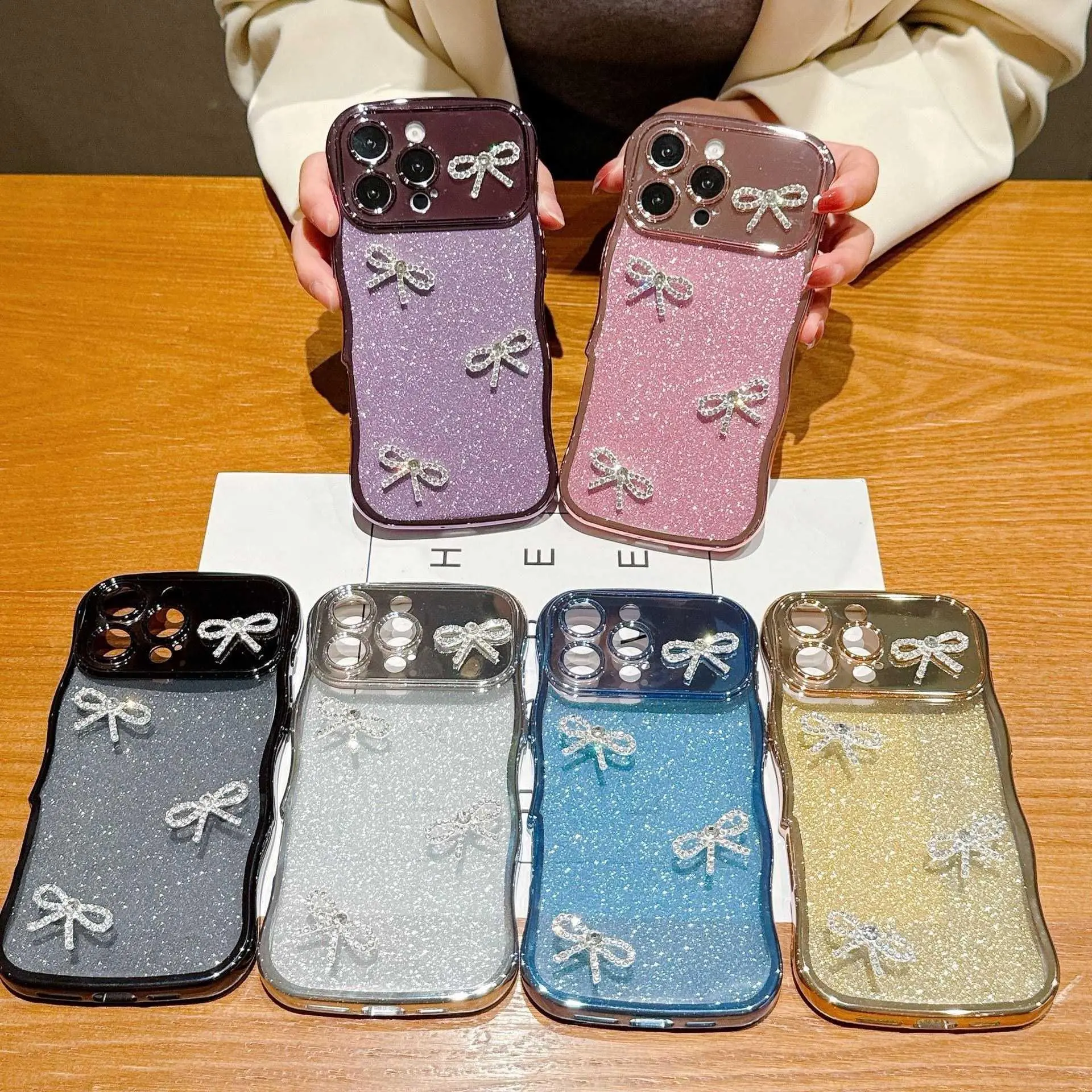 For iPhone 17 Pro Max Electroplated Transparent Wave Large Window + Solid Color Glitter + Rhinestone Bow Phone Case HNAD28PLQWE