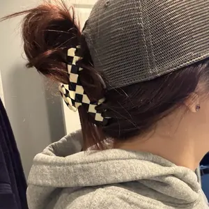 The Kacee Checkered Black and White Hair Clip with a Bold, Retro Vibe for a Vibrant Look Designed for Adjustable Hats