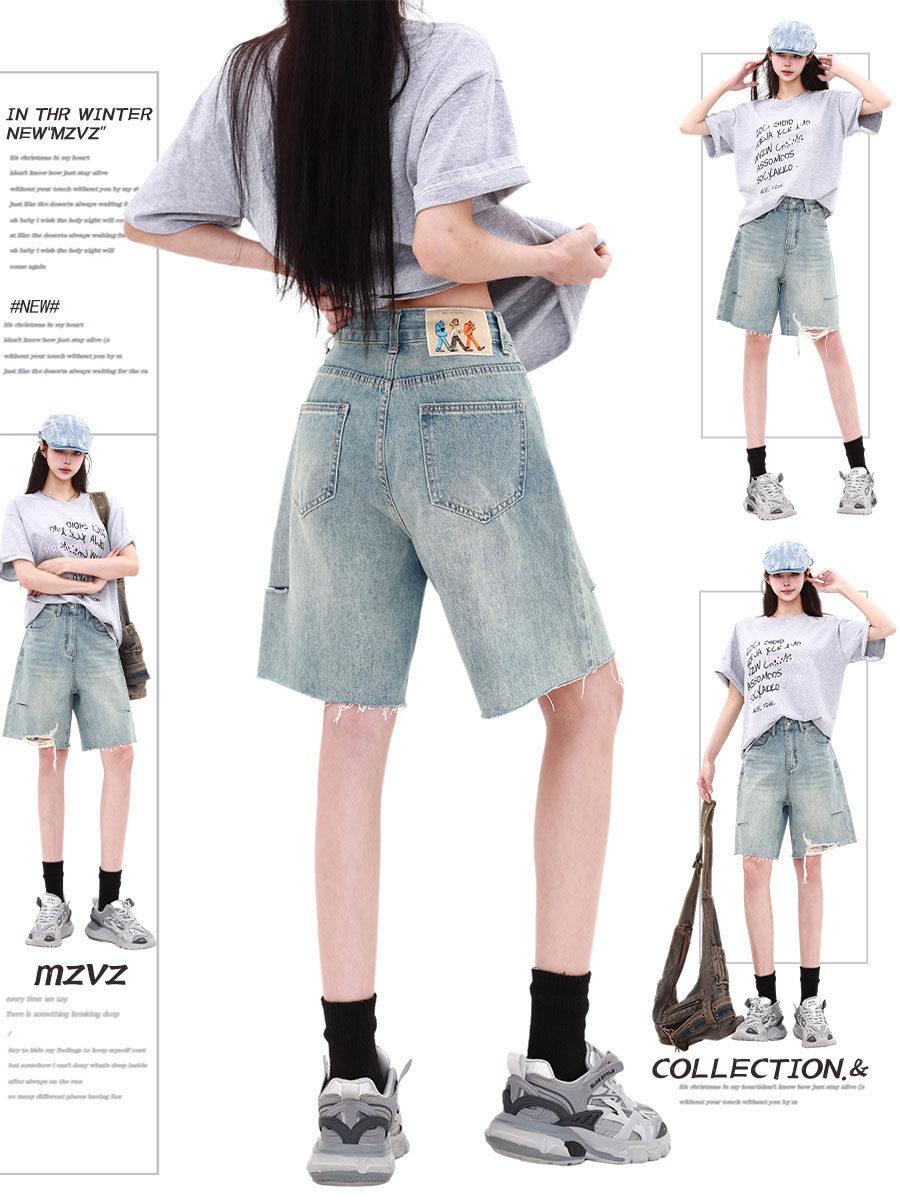 Women’s American vintage light blue mid-length denim shorts for summer — high-waisted, loose straight cut with rips, wide-leg design