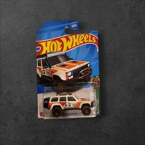 2023 Hot Wheels '95 jeep Cherokee Mud Studs Treasure Hunt (white/red/orange)
