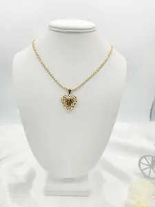 Necklace with openwork heart pendant in 14k gold plated.