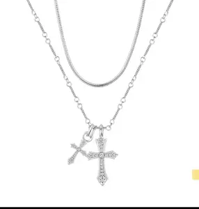 Lyrasses X Ferrberty Silver Double Cross Pendant, plated with 14K Gold/Silver, suits all. Its sleek design fits daily and parties. An Easter hope symbol and Valentine's love token, it shows charm and conveys feelings.