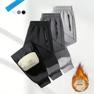 Men’s three-stripe jogger pants with a drawstring waistband, side zipper, fleece lining, urban commuter workwear, relaxed fit with an elastic waistband and ankle cuffs, fleece-lined training and gym apparel