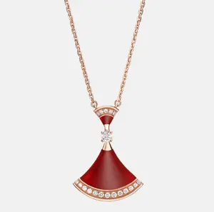 Pre-owned Bvlgari Divas' Dream 18 kt rose gold pendant necklace with chain set with red carnelian elements, a round brilliant cut dia and pavé