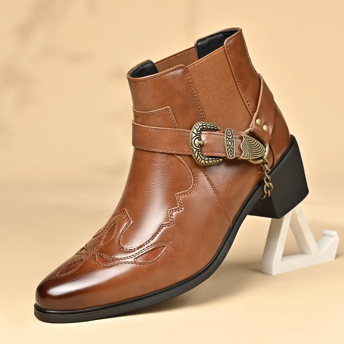 Men’s Western-style ankle boots with retro embroidery, square toe and chunky heel design, PU leather upper, side fashion metal buckle paired with chain detailing, non-slip sole, suitable for everyday wear in all seasons.
