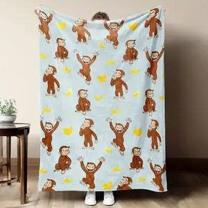 digital printed flannel Warm Throw Blanket with a Curious George monkey and banana pattern, suitable for sofas, beds, travel, camping, and office use. Made of warm, comfortable, and soft fabric, machine washable, for birthday and holiday gifts