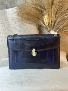 Pre-owned Bulgari Serpenti Forever flap bag in navy blue lizard leather. Features the iconic enameled snake head closure 1919H0654