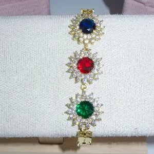 Elegant Jewelry Piece with Blue, Red, and Green Gems in a Butterfly Design, Gold Tone Setting