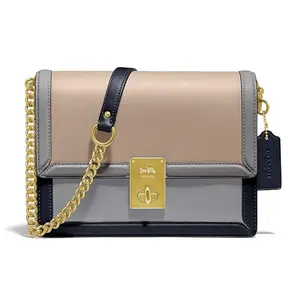 COACH Hutton Leather Crossbody Bag with Flap Closure in Blue and Brown for Women