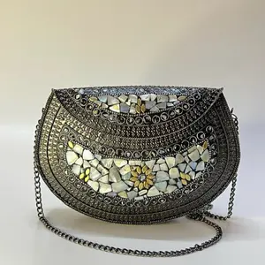 Mettalic clutch with mosaic and mop design