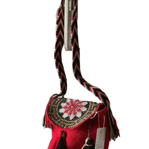 Wayuu Handwoven  Medium Size bag. Round Base . Bucket Style. Beaded Lid . Tassel Detail.  Crossbody or Shoulder Strap wear.
