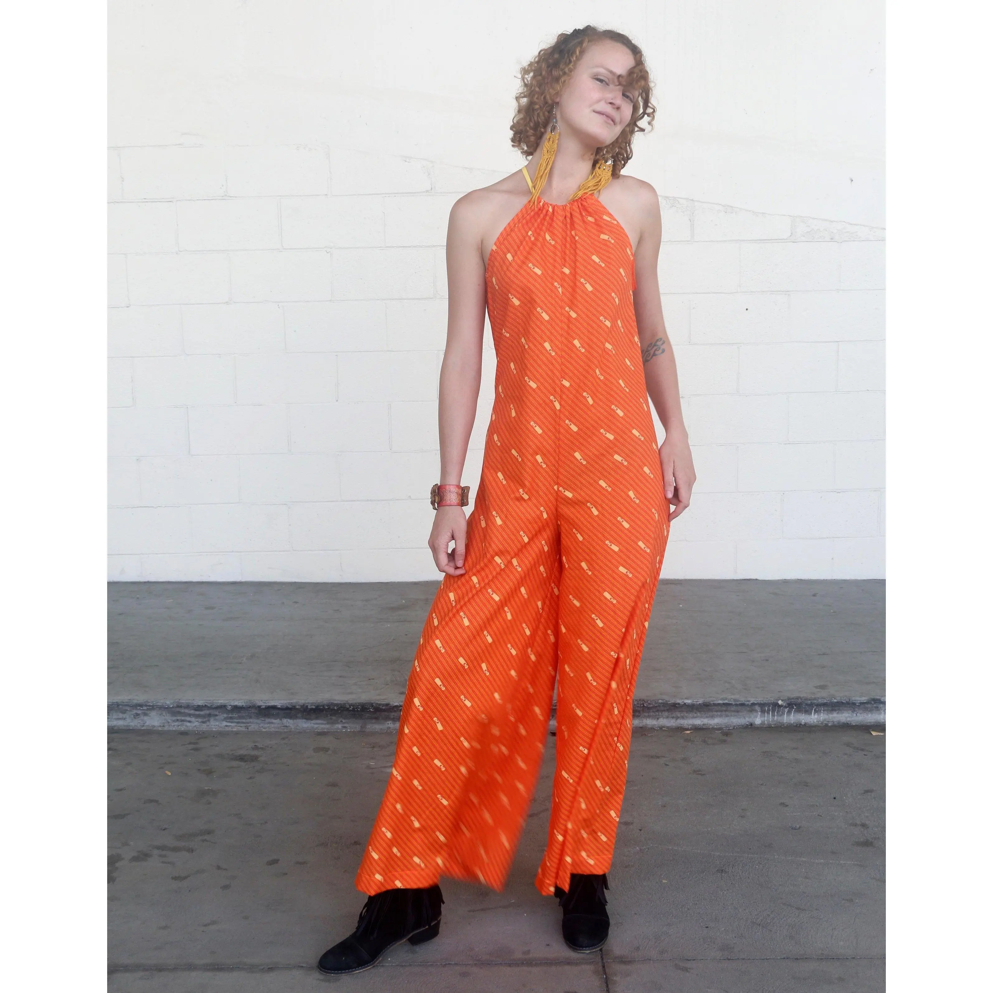 70S INSPIRED ORANGE SLEEVELESS HALTER TOP JUMPSUIT WITH MANDARIN ORANGE DIAGONAL ZIPPER PRINT