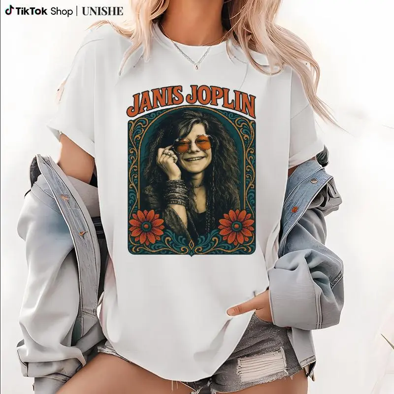 T - shirt featuring Janis Joplin portrait with vintage - style floral frame and typography, showcasing classic rock iconography, short - sleeve crewneck tee