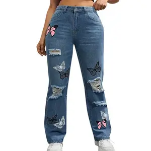 Women’s high-waisted straight-leg blue denim jeans with a button fly, butterfly print, ripped details, and a chic zipper closure — casual women’s wear for spring/summer 2025