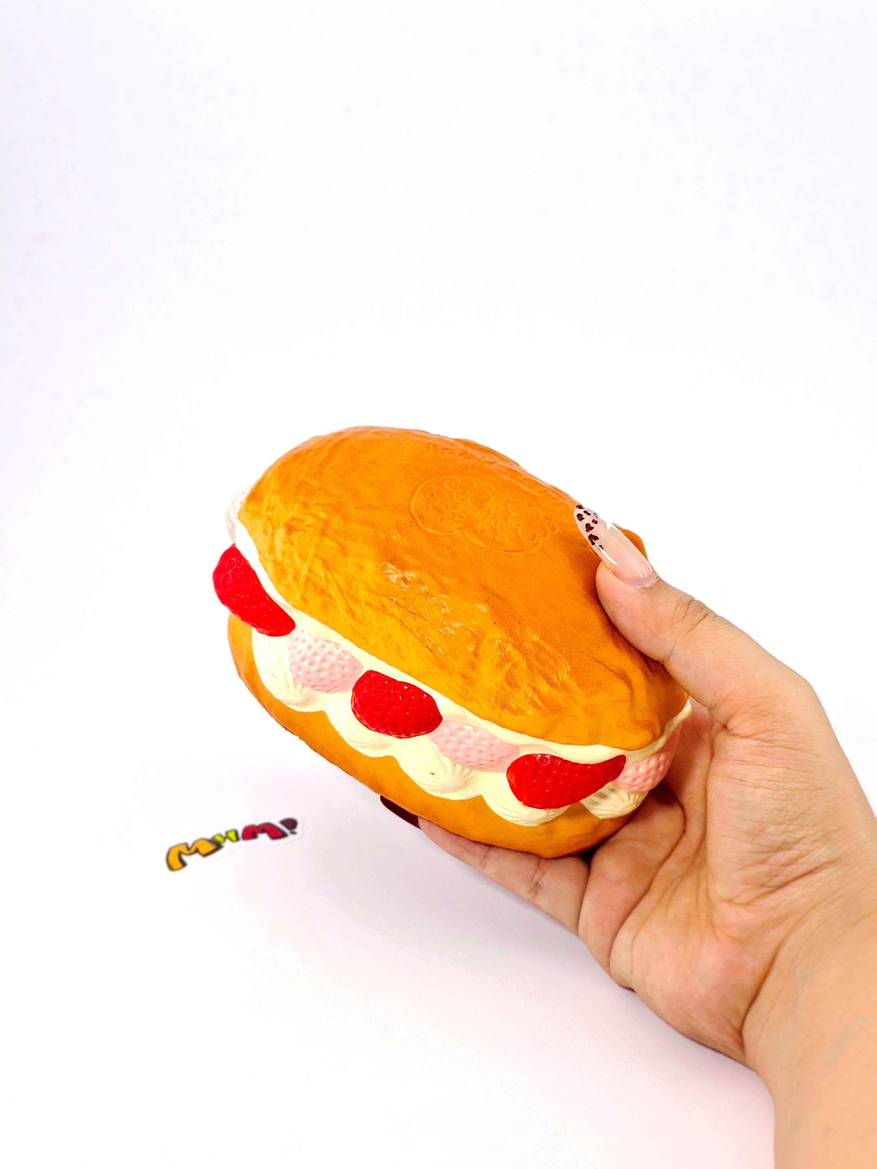 MHM Squishy Pink Strawberry White Cream Bread scented stress relief toy features a sticky, wet-soft, slow-bounce pastry texture for tactile fun