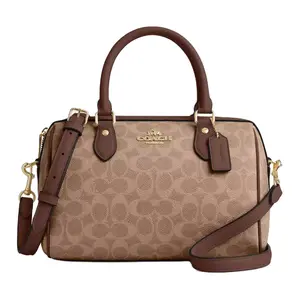 COACH Rowan 25 Crossbody Handbag for Women – Sticker-Printed Zip Closure, Coated Canvas, Medium Size, Tan and Brown Two-Tone