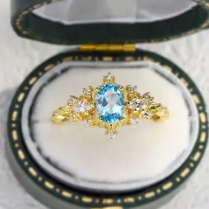 Unique Briar Rose Three Stone Oval Topaz Ring