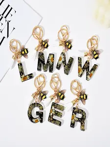 1pc/Initial letter keychain accessories Trendy Cute Keychain Chic Daisy-Inspired Resin Initial Keychain with Golden Bee Charm and Yellow Tassel Fashionable Acrylic Letter Key ring for Women Ideal Backpacks Valentine's Gift