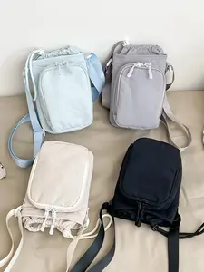 Minimalist and lightweight light colored mini bag, foldable and drawstring zipper double opening design, adjustable shoulder strap, can accommodate mobile phones and keys, suitable for daily commuting, shopping, and going out