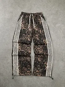 Unisex Leopard Print Casual Pants, Side Stripe Patchwork Design, Drawstring Cuffed Hem, Trendy Streetwear Hip Hop Style, Casual Streetwear Trousers
