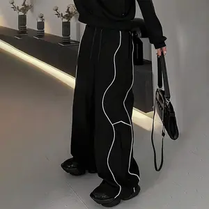Men's all-season European and American style loose-fit patchwork striped outdoor casual pants, perfect for outdoor activities and leisure wear.
