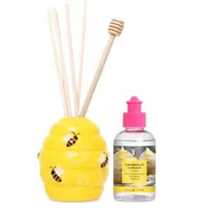 PINK ZEBRA REED DIFFUSER AND A BOTTLE OF DIFFUSER OIL