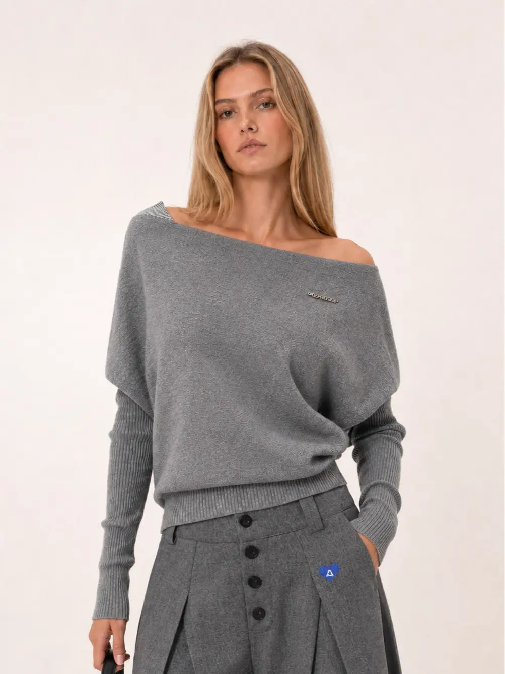 Aelfric Eden Women's Fitted Off-Shoulder Draped Knit Sweater - Asymmetric Cut, Layered Ribbed Sleeves, Metal Logo Pin, Ribbed Waist Hem, Soft Viscose Fabric, Minimalist Streetwear Vibe, Medium-Length Casual Top, Knitwear, Flattering Tops, Fitted Cut