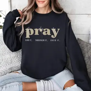 Christian sweatshirt with “Pray for It, Pray Over It” and Jesus-inspired designs, cozy crewneck style, perfect for faith, Bible verses, and inspiring daily wear.