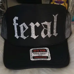 Otto- Black FERAL trucker hat with silver Blingy writing Fashion Accessory