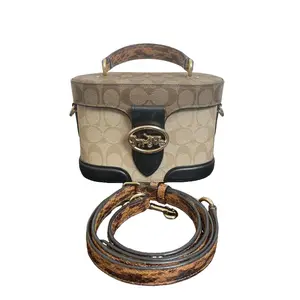 Pre-owned coach canvas Shoulder Bags Classic Monogram Colorblock Snake Embossed Handle Vanity Case Horse Carriage Shoulder Bag with Vintage Gold Tone Hardware and Detachable Strap